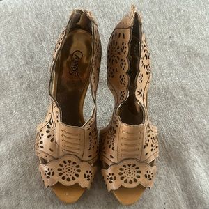 Carlos Santana heels. Nude in color laser cutouts.